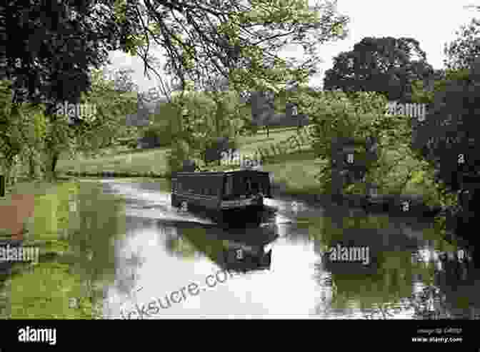 A Narrowboat Glides Through A Tranquil Canal, Surrounded By Lush Greenery And Picturesque Cottages. A Narrowboat And A Notebook (The Narrowboat Lad 2)