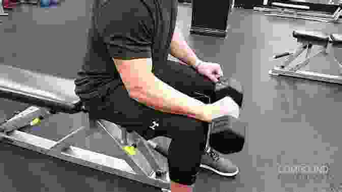 A Person Performing A Reverse Wrist Curl With A Barbell Hand And Forearm Exercises: Grip Strength Workout And Training Routine